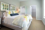 Chattanooga apartment for rent - a bedroom with a bed and a door to a closet at One Riverside Apartments, Chattanooga