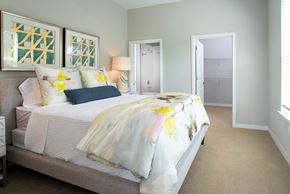 Chattanooga apartment for rent - a bedroom with a bed and a door to a closet at One Riverside Apartments, Chattanooga