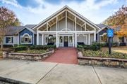 Warner Robins apartment for rent - A building with a blue handicap sign in front.