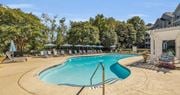 Chattanooga apartment for rent - a swimming pool with umbrellas next to a building at Marina Point, Chattanooga, TN 37415