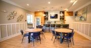 Hixson apartment for rent - a dining room with tables and chairs and a kitchen  at Lullwater at Big Ridge, Hixson, Tennessee