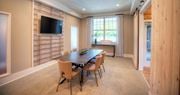 Hixson apartment for rent - a dining room with a table and chairs and a television  at Lullwater at Big Ridge, Hixson, Tennessee