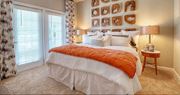 Hixson apartment for rent - a bedroom with a bed and a large window  at Lullwater at Big Ridge, Tennessee, 37343