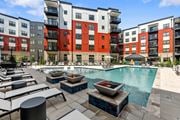 Richmond apartment for rent - an outdoor pool with lounge chairs and fire pits at the bradley braddock road station at Tapestry West, Richmond Virginia