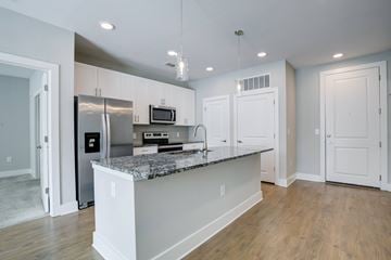 Lawrenceville apartment for rent - A kitchen with a granite countertop and stainless steel appliances.