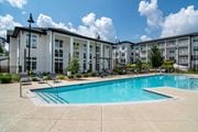 Acworth apartment for rent - A swimming pool in front of apartment buildings.