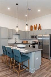 Chesterfield apartment for rent - a kitchen with a center island and a stove top oven at Livingston Flats Apartments, Chesterfield, VA