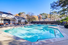 Augusta apartment for rent - A large swimming pool with a slide and sun loungers.