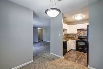 Augusta apartment for rent - A kitchen area with a stove and oven is visible through the open door.