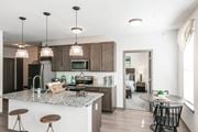 Knoxville apartment for rent - a kitchen and dining area with a marble counter top at Village at Westland Cove Apartments, Tennessee