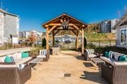 Knoxville apartment for rent - the outdoor patio of a home with chairs and a gazebo at Village at Westland Cove Apartments, Knoxville, 37922