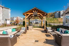 Knoxville apartment for rent - the outdoor patio of a home with chairs and a gazebo at Village at Westland Cove Apartments, Knoxville, 37922