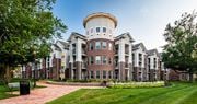 Richmond apartment for rent - a large building with a round tower on top of it at Canopy at Ginter Park Apartments, Richmond, VA, 23227