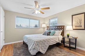 Columbus apartment for rent - a bedroom with a bed and a ceiling fan
