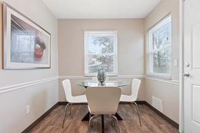 Columbus apartment for rent - a dining room with a table and chairs and a window