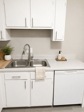 Columbus apartment for rent - A kitchen with white cabinets and a stainless steel sink.