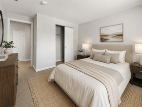Columbus apartment for rent - A bedroom with a large bed and a painting on the wall.