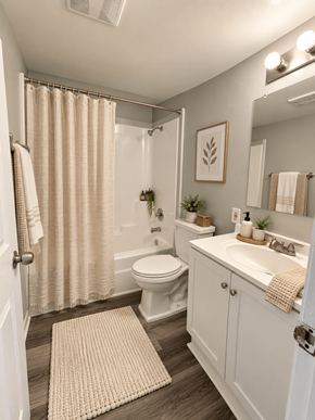 Dekalb apartment for rent - A bathroom with a toilet, sink, and shower.