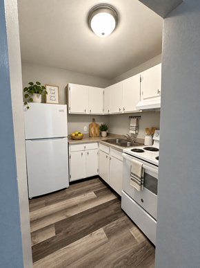 Dekalb apartment for rent - A kitchen with white appliances and cabinets.