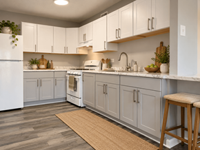 Washington apartment for rent - A kitchen with white cabinets and a white refrigerator.