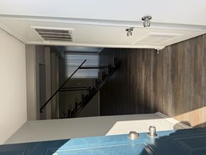 Columbus apartment for rent - A room with a staircase and a wooden wall.