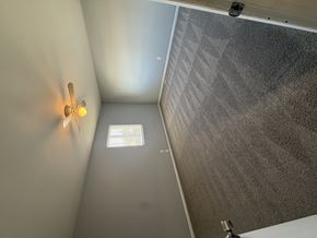 Columbus apartment for rent - A ceiling fan with a light on in a room with a window.