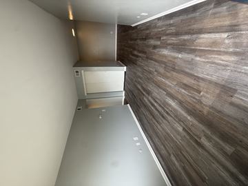 Columbus apartment for rent - A wall of wood paneling runs along the wall.
