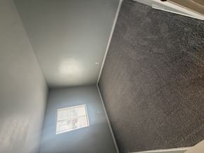 Columbus apartment for rent - A small window in a room with a grey wall.