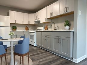 Washington apartment for rent - A kitchen with a table and chairs. at The Langston Views, Washington, 20020