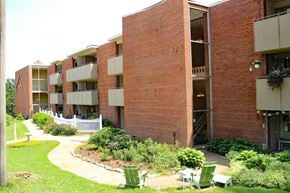 St. Louis apartment for rent - a picture of a building with a garden in front of it