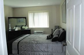 St. Louis apartment for rent - a bedroom with a bed and a dresser in it