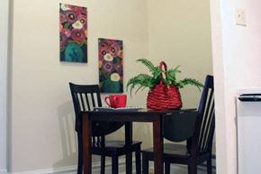 St. Louis apartment for rent - a table and chairs in a small room