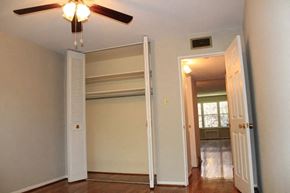 Webster Groves apartment for rent - a bedroom with a ceiling fan and a closet with a door open