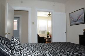 St. Louis apartment for rent - a bedroom with a bed and a window