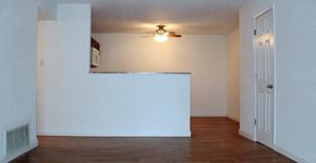 St. Louis apartment for rent - an empty room with a ceiling fan and a door