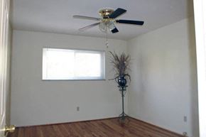 Webster Groves apartment for rent - a room with a ceiling fan and a window