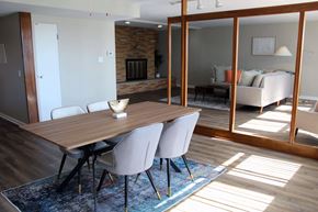 St. Louis apartment for rent - a dining room with a wooden table and white chairs