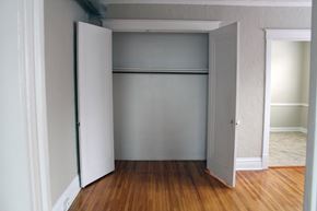 St. Louis apartment for rent - A white door is open to a room with a wooden floor.