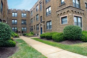 St. Louis apartment for rent - A brick building with a walkway in front.