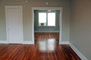 St. Louis apartment for rent - A room with a wooden floor and a window.