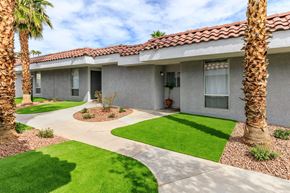 Las Vegas apartment for rent - a house with a yard and palm trees