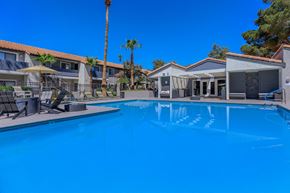 Las Vegas apartment for rent - the swimming pool at the resort combines a large blue pool with chairs and tables