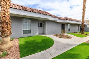 Las Vegas apartment for rent - the front of a house with a yard and grass