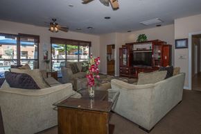 Victorville apartment for rent - A living room with a couch, chair, and television.