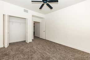 Las Vegas apartment for rent - a bedroom with carpet and a ceiling fan