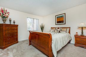 Indio apartment for rent - a bedroom with a bed and two dressers