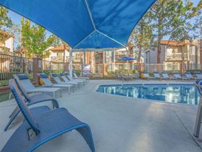 Orange apartment for rent - our apartments have a resort style pool and lounge chairs