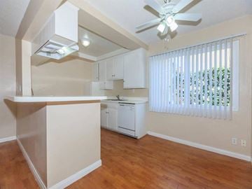 Pico Rivera apartment for rent - A kitchen with a white dishwasher and a ceiling fan.