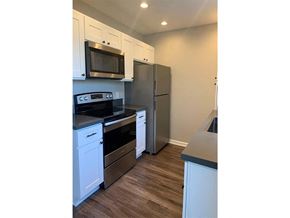 Ventura apartment for rent - A kitchen with white cabinets and stainless steel appliances.