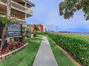 Ventura apartment for rent - A sign for Beachfront Townehomes - Renters is in front of a building.